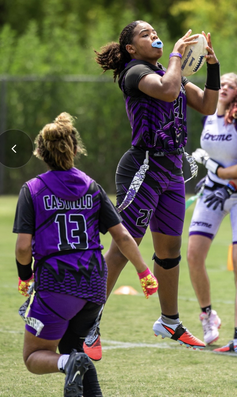 Flagzilla players in purple and black team jerseys during a game